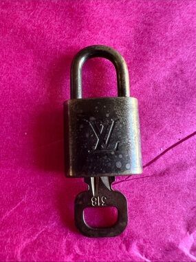 Louis Vuitton bronze-toned padlock with key